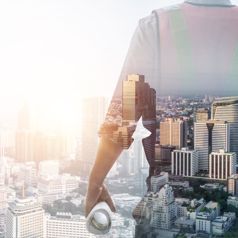 Menschliche Silhouette vor einer Stadtlandschaft bei Sonnenlicht.